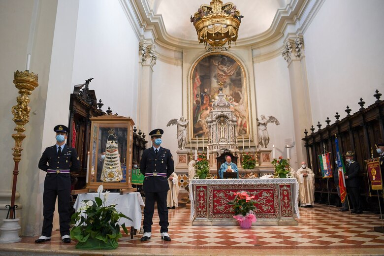 Two Italian air force members stand guard by a Madonna Di Loreto statue during holy mass in Pordenone, Italy, Sept. 29, 2020. The Madonna Di Loreto is the Patroness of Aeronauts, as declared by Pope Benedict XV. (U.S. Air Force photo by Staff Sgt. Savannah L. Waters)