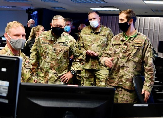 Army Maj. Gen. Bret Daugherty, center left, Washington National Guard adjutant general, and Air Force Brig. Gen. Gent Welsh, Washington Air National Guard commander, observe various software demonstrations of the Advanced Battle Management System at Joint Base Lewis-McChord, Wash., Sept. 2, 2020. The ABMS and the Army's Project Convergence will be combined as part of a new two-year agreement between both branches. (U.S. Army photo by Maj. Kimberly Burke)