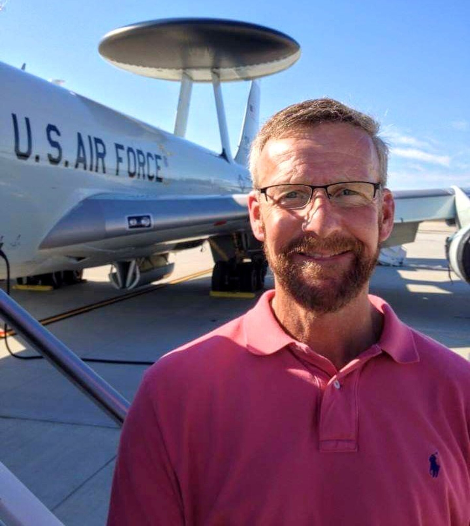 Steve Ober, Diversity and Inclusion manager at Hanscom Air Force Base, Mass., stands in front of an E-3 Airborne Early Warning and Control System aircraft at Pease Air Force Base, N.H., in 2016. As the installation D&I manager, Ober will facilitate events, training and resources to create a more inclusive Hanscom community. (Courtesy Photo)