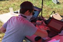 IMAGE: DAHLGREN, Va. - Naval Surface Warfare Center Dahlgren Division (NSWCDD) scientist William Filkoski records surface observations and analyzes sounding data in support of a collaborative research project combining the Navy’s next-generation laser weapons with maritime environmental challenges. Filkoski is supporting the effort while on a New Employee Developmental Assignment (NEDA) which offers a unique development opportunity to entry-level scientists and engineers. NEDAs are temporary assignments, typically 4 to 6 months in duration, to other parts of NSWCDD.