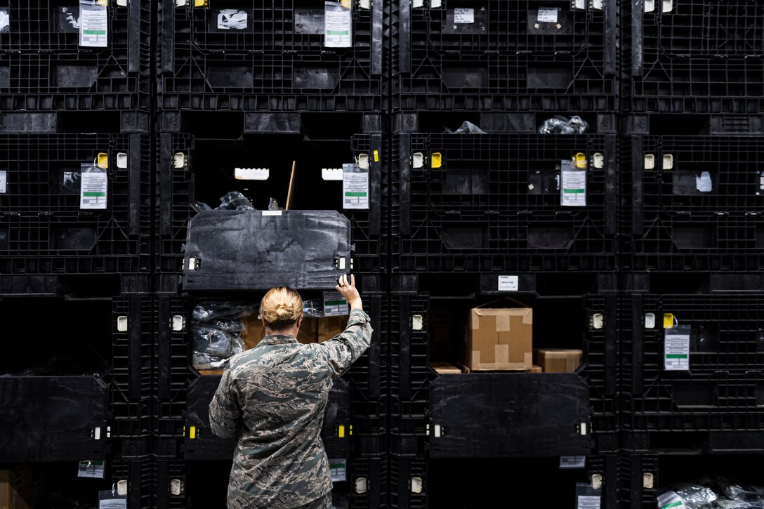 A photo of an Airman validating locations of gear