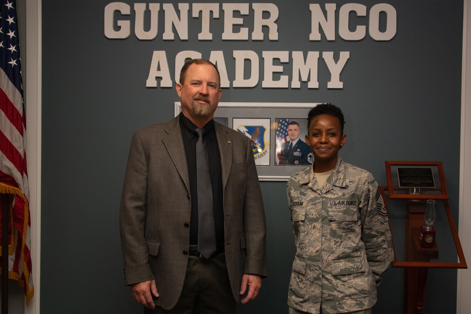 Toxie Robbins, former Gunter Noncommissioned Officer Academy commandant, poses for a photo beside Chief Master Sgt. Rosita Goodrum, the new commandant of Gunter NCOA