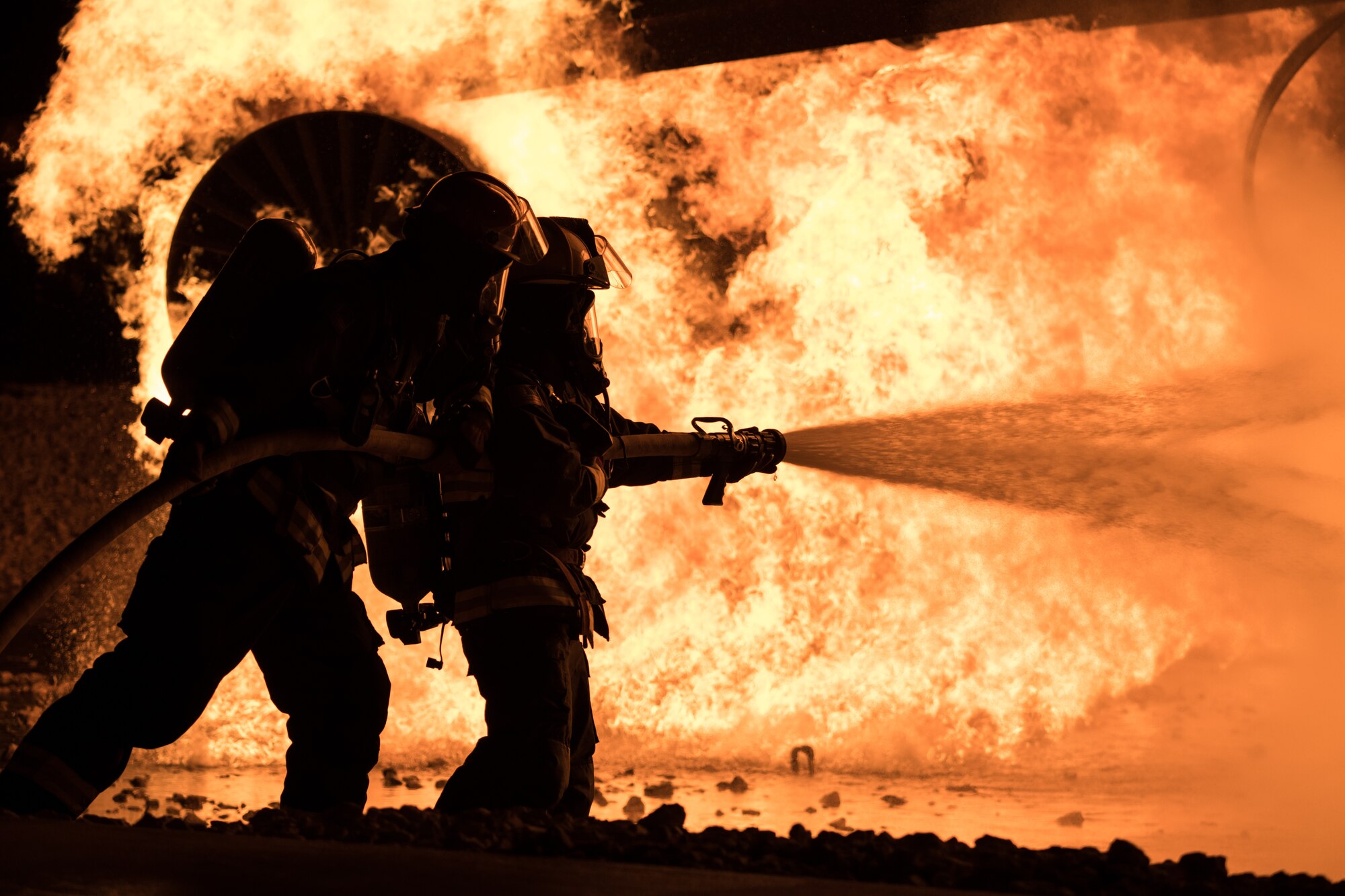 Airmen extinguish live fire during exercise