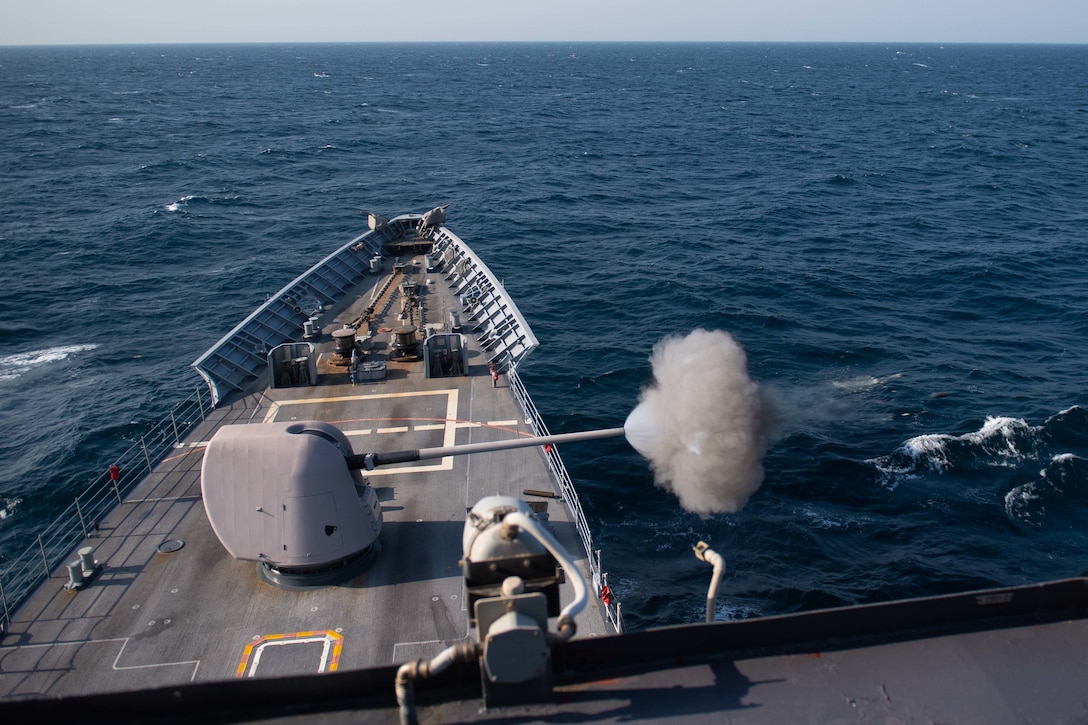 ARABIAN GULF (Sept. 28, 2020) - The guided-missile cruiser USS Princeton (CG 59) fires its Mark 45 5-inch gun during a live-fire exercise in the Arabian Gulf, Sept. 28. Princeton is part of the Nimitz Carrier Strike Group and is deployed to the U.S. 5th Fleet area of operations to ensure maritime stability and security in the Central Region, connecting the Mediterranean and Pacific through the Western Indian Ocean and three critical chokepoints to the free flow of global commerce. (U.S. Navy photo by Mass Communication Specialist 2nd Class Logan C. Kellums)