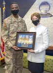 Col Jacob Middleton, Aerospace Data Facility-Colorado Commander, presents Secretary of the Air Force Barbara Barrett with a commemorative plaque during her visit to ADF-C.