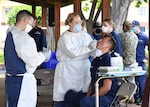 NMRTC-PH Sailos put on masks, gloves, gowns, and protective eye equipment.