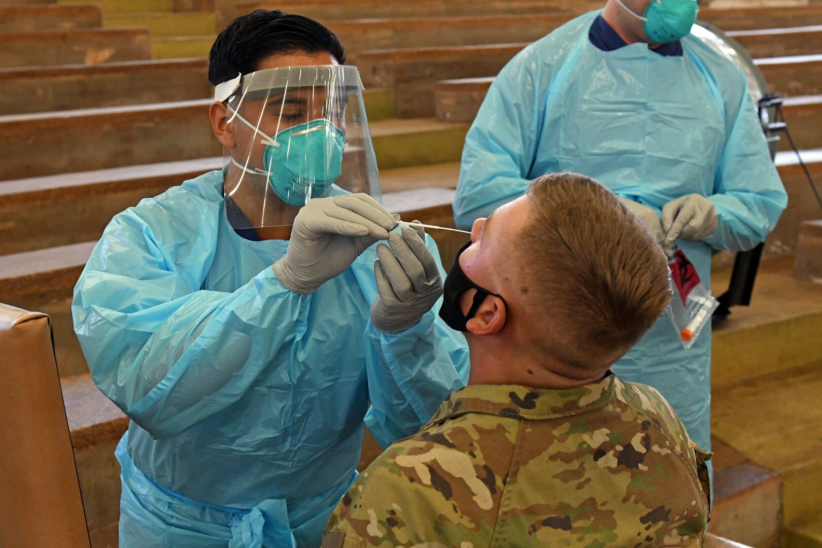 Sailor swabs Soldier's nose.