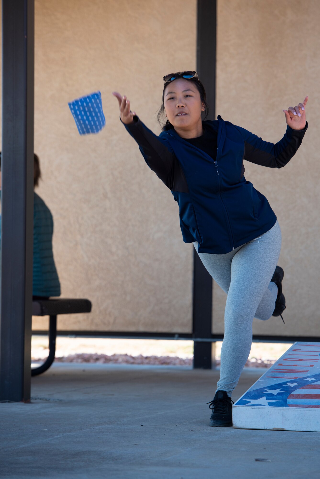 Senior Airman Kalissa Vue, 50th Space Communications Squadron commander support staff lead, plays a game of cornhole during Wingman Day at Schriever Air Force Base, Colorado, Oct. 1, 2020. This year, events such as yoga classes, rock painting, bocce ball, basket weaving and more were available for Team Schriever over the course of four days. (U.S. Space Force photo by Airman 1st Class Amanda Lovelace)