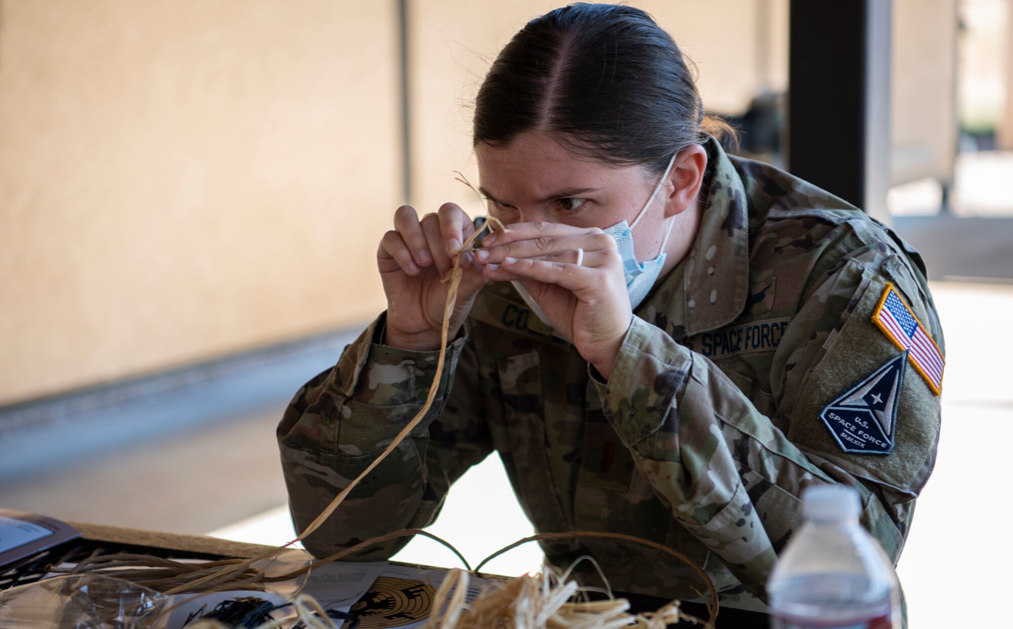 Second Lt. Peyton Cooper, 3rd Space Experimentation Squadron mission planner, weaves a basket during a Wingman Day activity at Schriever Air Force Base, Colorado, Oct. 1, 2020. This year, Wingman Day was spread across four days to encourage maximum participation while safely adhering to COVID-19 health protection guidance. (U.S. Space Force photo by Airman 1st Class Amanda Lovelace)