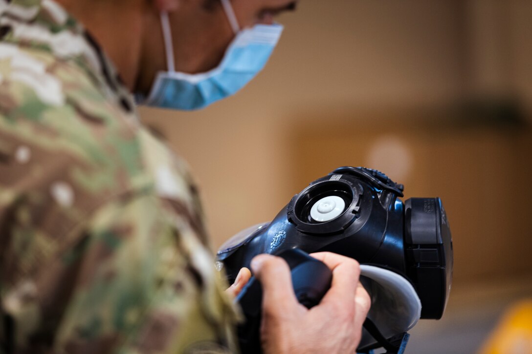 A photo of a customer validating a serial number on a gas mask