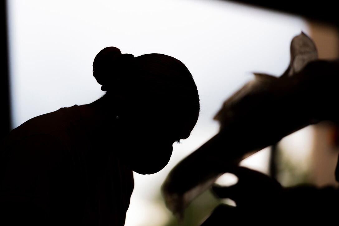 A photo of an Airman signing in equipment
