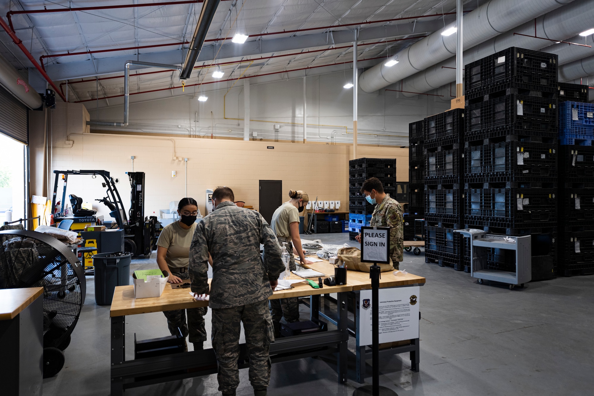 A photo of customers signing in to return equipment