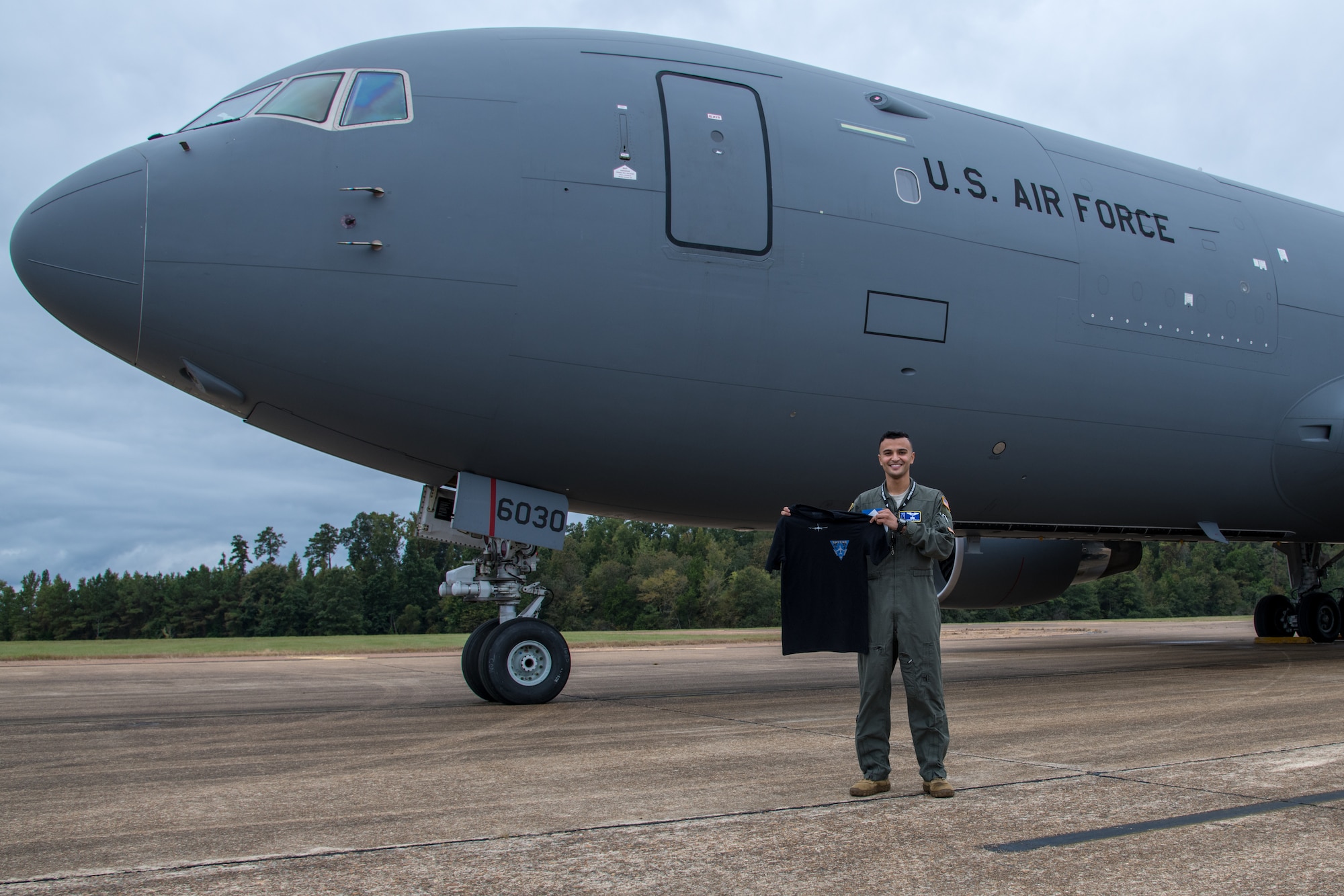 Second Lt. Alisson Moraes, 14th Student Squadron undergraduate pilot training graduate, poses with a 344th Air Refueling Squadron t-shirt in front of a KC-46A Pegasus Sept. 25, 2020 at Columbus Air Force Base, Mississippi. Moraes received the KC-46 as his future aircraft assignment, which became his number one choice after touring the aircraft for the first time in 2019. (U.S. Air Force photo by Senior Airman Skyler Combs)