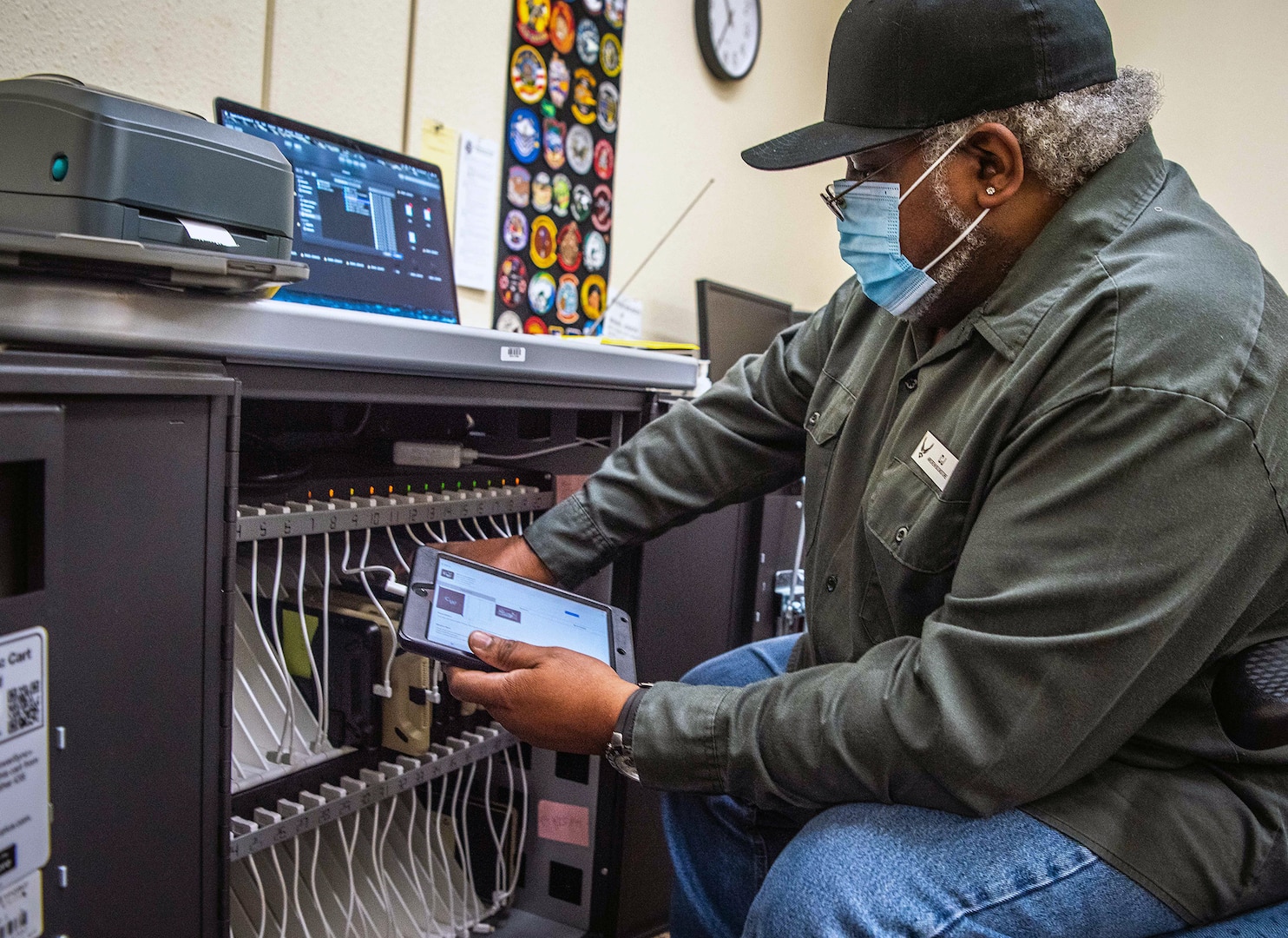 Charlie Turner, 12th Training Squadron electronic flight bag hardware manager, loads EFB devices into a charging station as he prepares for a software update Oct. 1, 2020, at Joint Base San Antonio-Randolph.