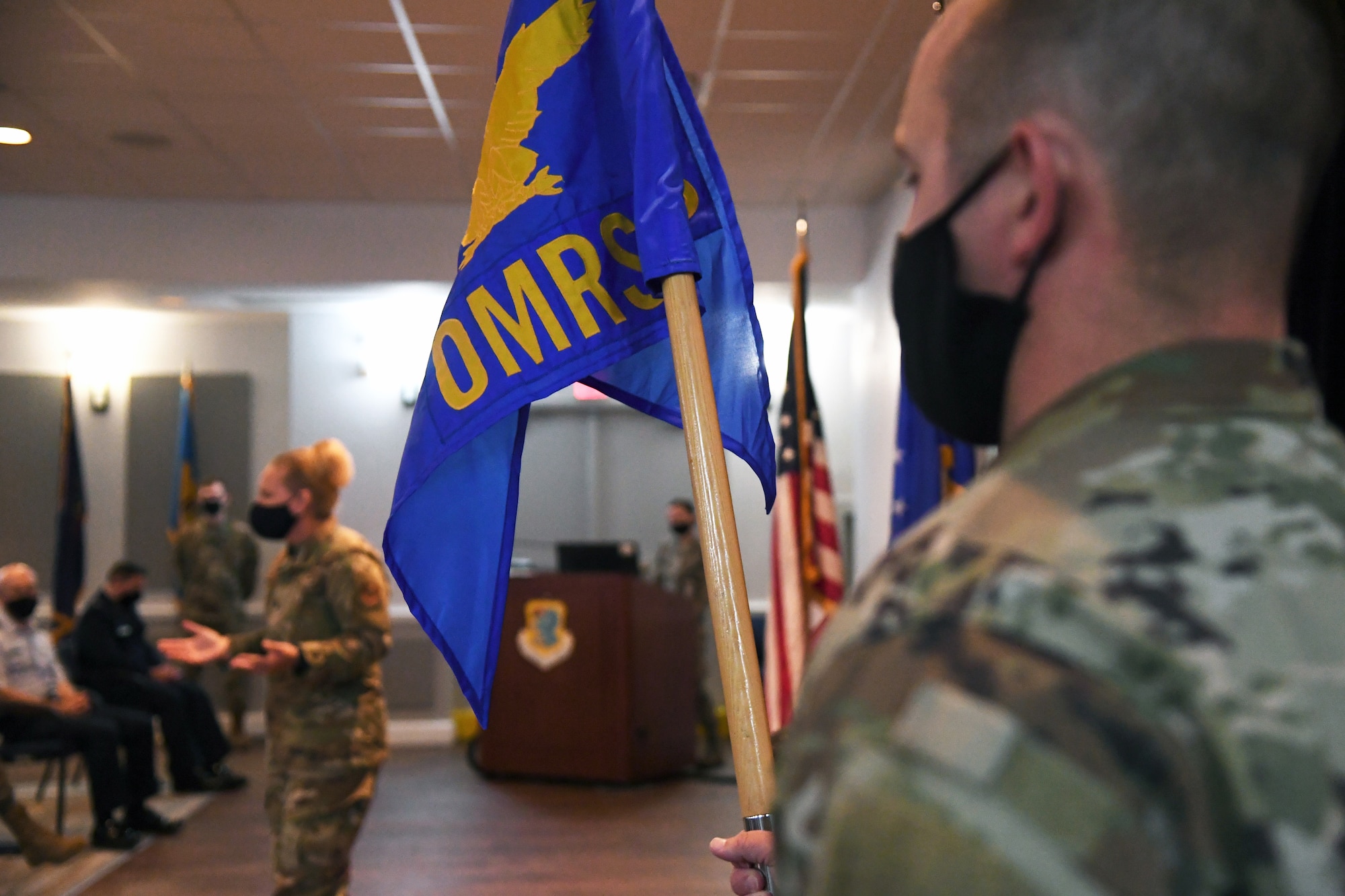 U.S. Air Force Master Sgt. Jeremy Keely, 81st Operational Medical Readiness Squadron superintendent, presents the 81st OMRS guidon during a redesignation ceremony inside the Keesler Medical Center at Keesler Air Force Base, Mississippi, September 30, 2020. In an effort to meet Department of Defense policy to increase operational medical readiness and duty availability for active duty personnel, while continuing to ensure the delivery of high quality health care, the 81st OMRS replaced the 81st Aerospace Medicine Squadron. (U.S. Air Force photo by Kemberly Groue)