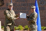 U.S. Air Force Maj. Gen. Aaron Prupas, North American Aerospace Defense Command and U.S. Northern Command Director of Intelligence, presents the Joint Service Achievement Medal to Master Sgt. David Stergion Jr., NORAD and USNORTHCOM NCO-in-charge of Intelligence Plans and Exercises, Sept 28, 2020, for his heroic actions on the night of Feb. 14, 2020. Sergeant Stergion demonstrated outstanding judgment and selflessness as the first person to respond to the scene of a serious car accident near Estes Park, Colorado, Feb. 14, 2020.