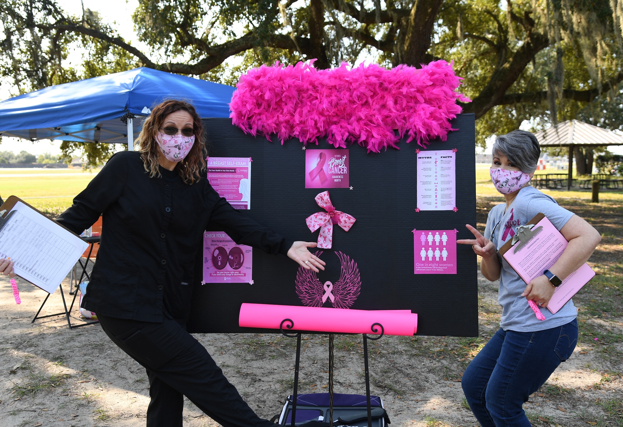 Kimberly Brown, 81st Diagnostic and Therapeutics Squadron radiology nurse, and Benita Campanella, 81st MDTS radiology instructor, pose for a photo during the 81st Medical Group Drive-Through Health Expo at the Marina at Keesler Air Force Base, Mississippi, October 2, 2020. The 81st MDG hosted the drive-through event, which included scheduling appointments for mammograms and multiple types of cancer and chronic diseases in honor of Breast Cancer Awareness Month. (U.S. Air Force photo by Kemberly Groue)