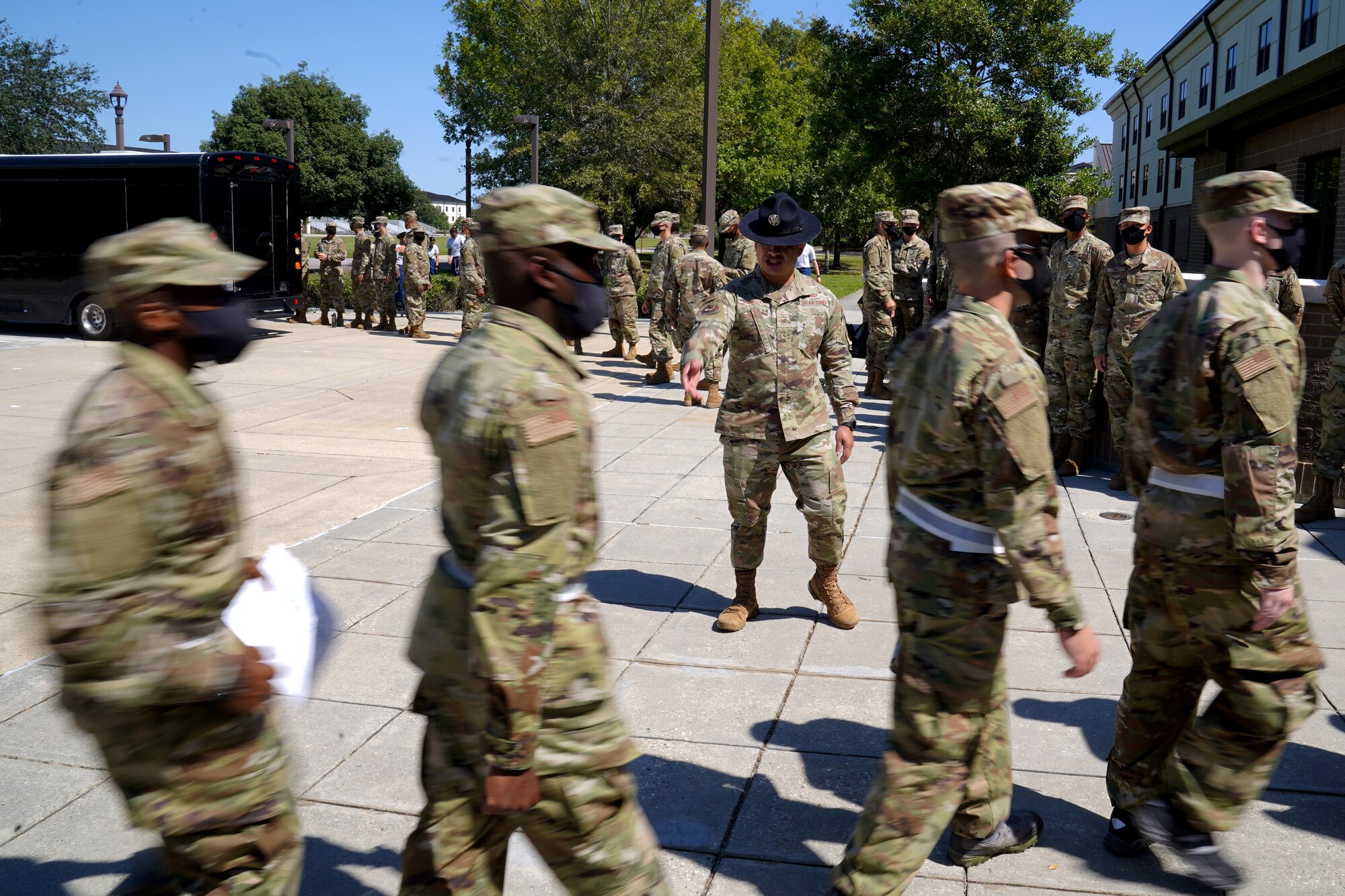 U.S. Air Force Tech. Sgt. Marcos Garcia, 37th Training Wing Detachment 5 military training instructor, leads basic military training trainees outside Erwin Manor at Keesler Air Force Base, Mississippi, Oct. 1, 2020. Garcia showcases the need for diversity by encouraging those he supervises to embrace the cultures of others in the military to help make a stronger Air Force. (U.S. Air Force photo bus Airman 1st Class Seth Haddix)