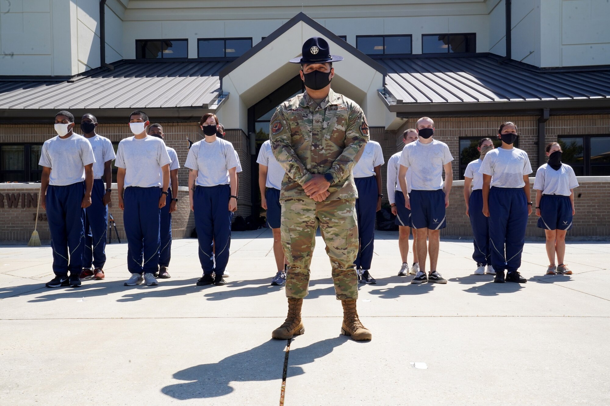 U.S. Air Force Tech. Sgt. Marcos Garcia, 37th Training Wing Detachment 5 military training instructor, and 81st Training Group students pose outside Erwin Manor at Keesler Air Force Base, Mississippi, Oct. 1, 2020. Garcia showcases the need for diversity by encouraging those he supervises to embrace the cultures of others in the military to help make a stronger Air Force. (U.S. Air Force photo bus Airman 1st Class Seth Haddix)