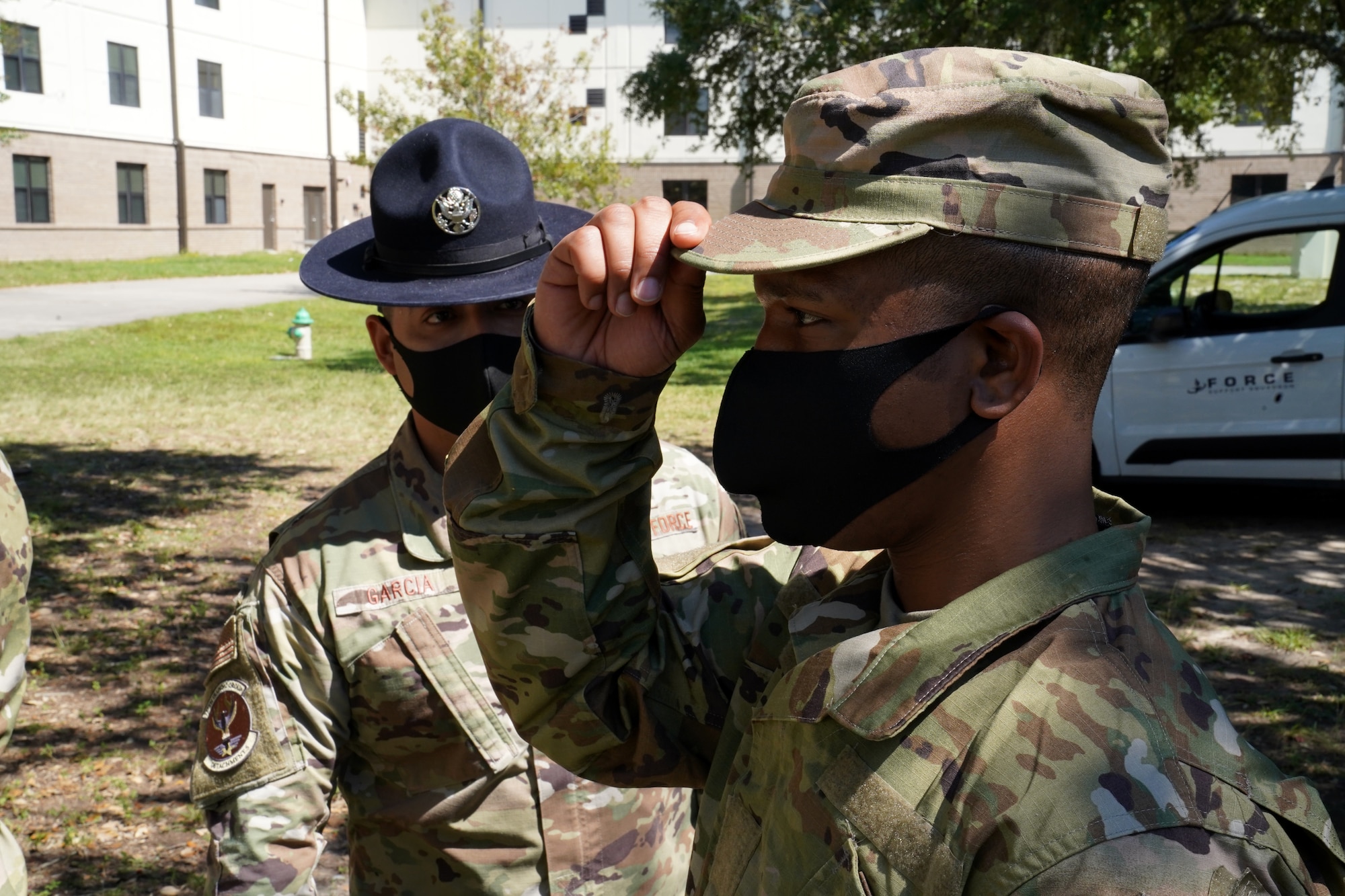 U.S. Air Force Tech. Sgt. Marcos Garcia, 37th Training Wing Detachment 5 military training instructor, confronts a basic military training trainee outside Erwin Manor at Keesler Air Force Base, Mississippi, Oct. 1, 2020. Garcia showcases the need for diversity by encouraging those he supervises to embrace the cultures of others in the military to help make a stronger Air Force. (U.S. Air Force photo bus Airman 1st Class Seth Haddix)