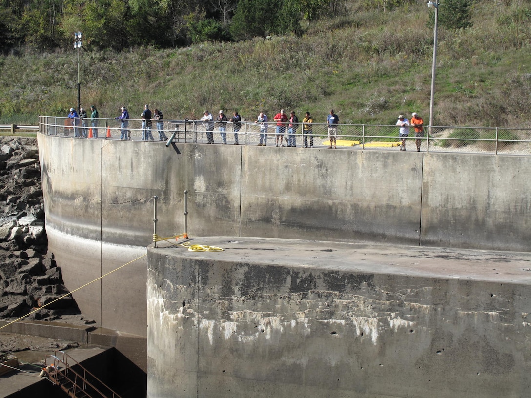 Visitors view the dewatered stilling basin during the periodic inspection in 2015.  Unlike previous inspections, the public will be prohibited from accessing the basin area due to ongoing construction.