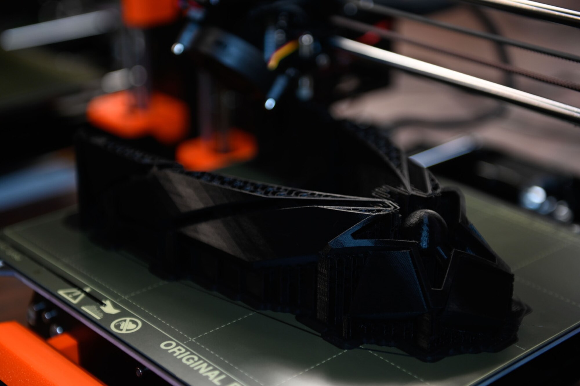 Airman holds 3D-printed award