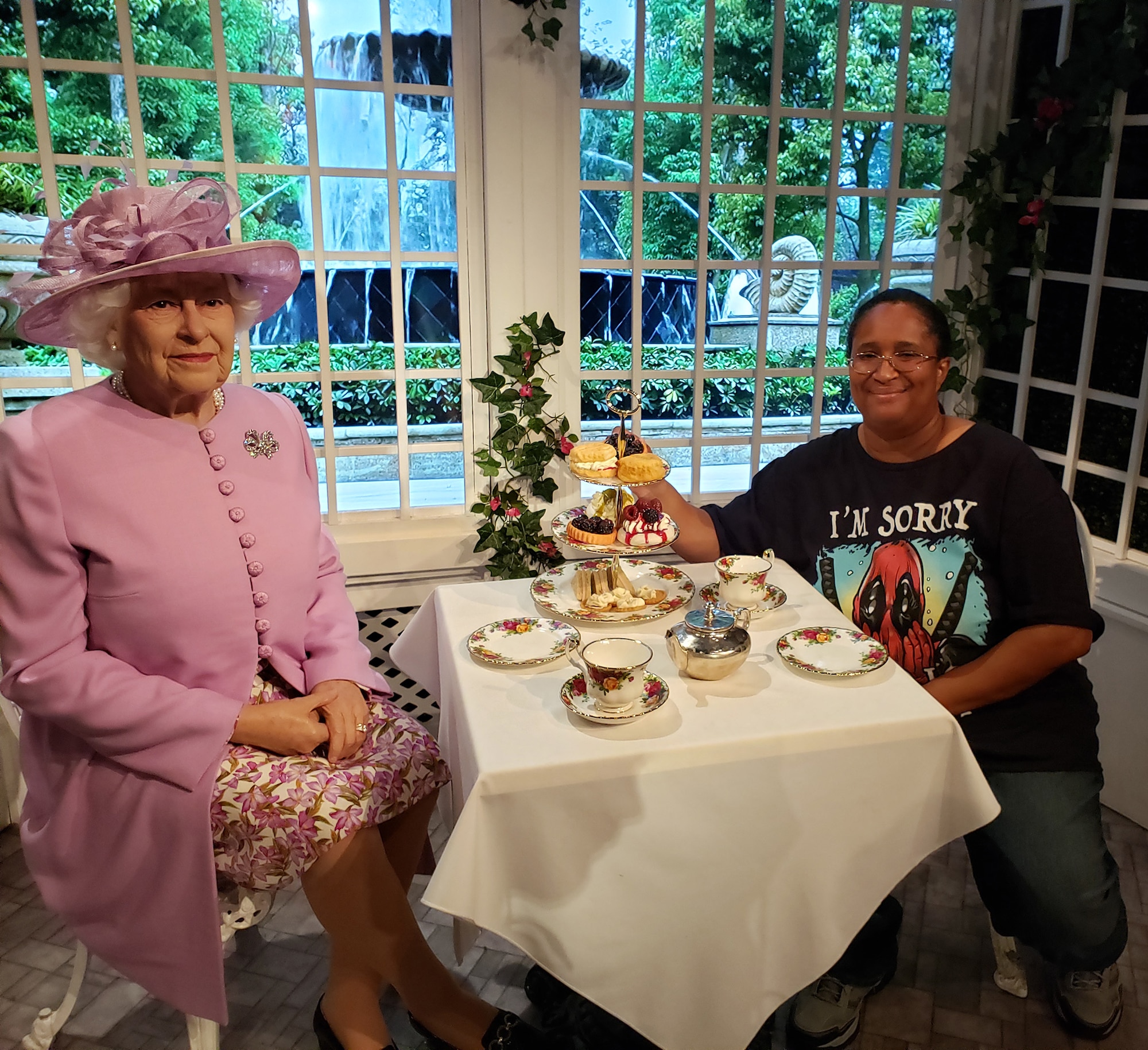 Candy Knight poses with a wax replica of Queen Elizabeth II at Madame Tussauds London. Knight is the Public Affairs Specialist for Headquarters Fourth Air Force at March Air Reserve Base, California. (Courtesy photo by Candy Knight)