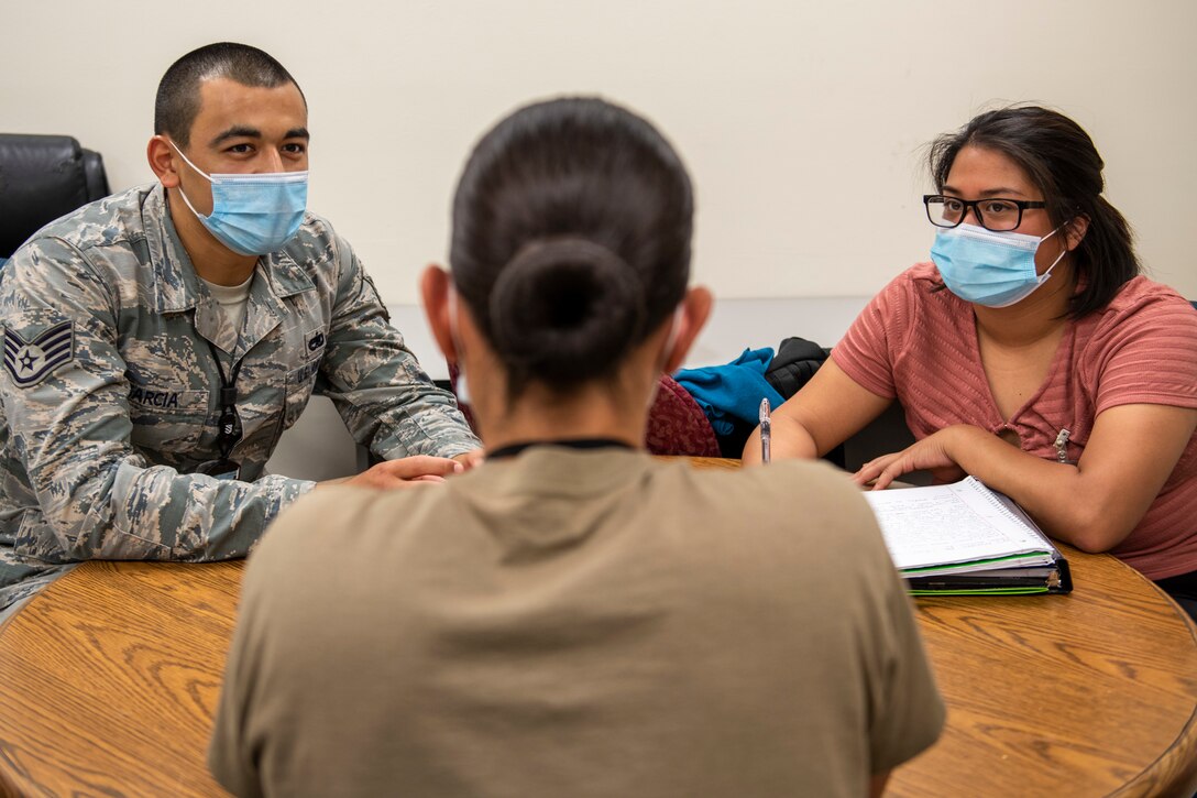 Staff Sgt. Raymond Garcia, left, and Senior Airman Jan Mariel Punelas, right, Leading for Innovation students, interview Airman 1st Class Alexandra Mendez, 7th Munitions Squadron armament weapons troop, at Dyess Air Force Base, Texas, Sept. 11, 2020.