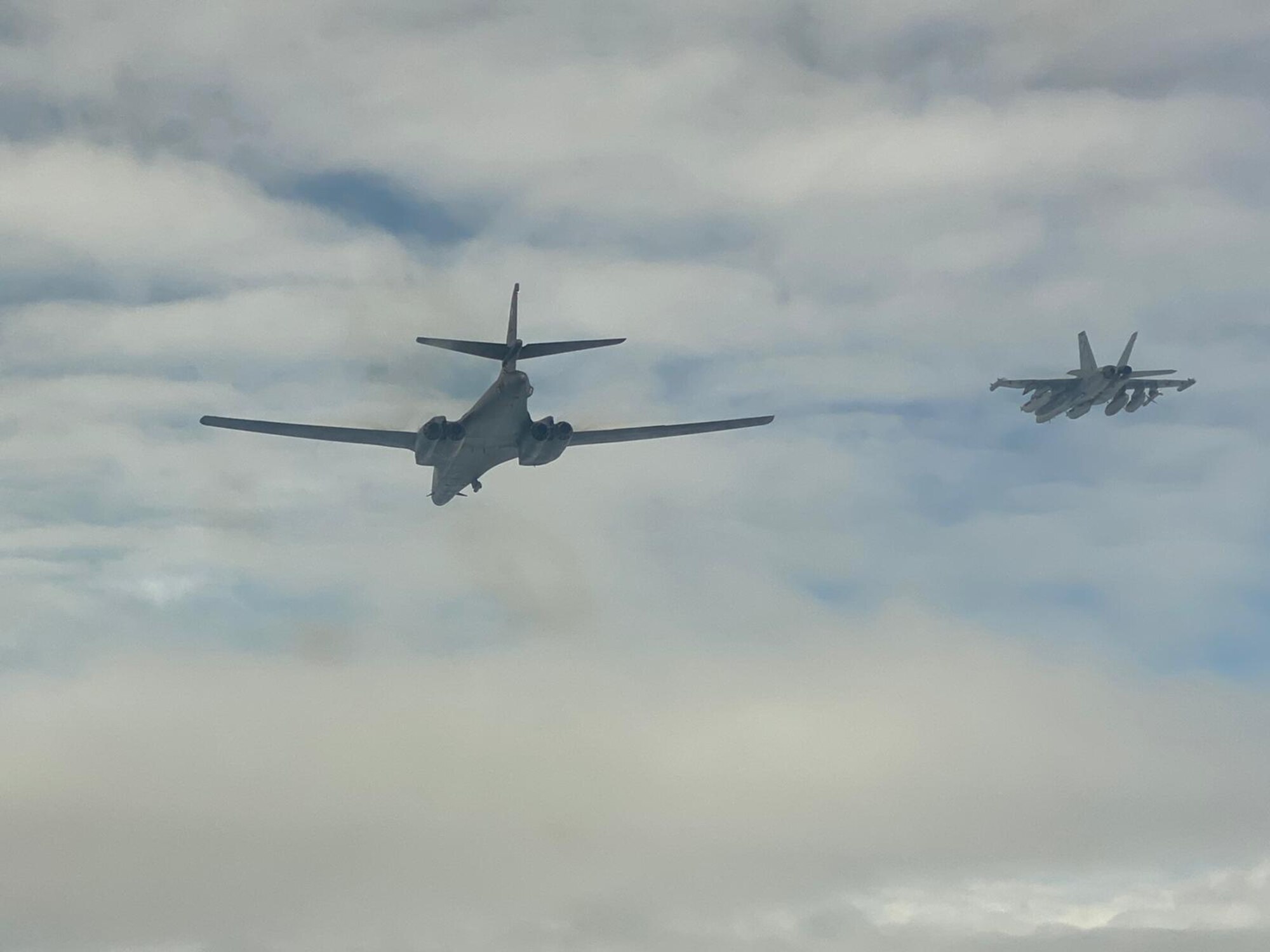 A B-1B Lancer from the 34th Expeditionary Bomb Squadron, Ellsworth Air Force Base, S.D., conducts integration training with a Navy E/A-18G Growler, deployed to Misawa Air Base, Japan, over the Sea of Japan, Sept. 30, 2020. The B-1 flew as part of a Bomber Task Force, accomplishing strategic objectives in support of a free and open Indo-Pacific. (Courtesy photo)