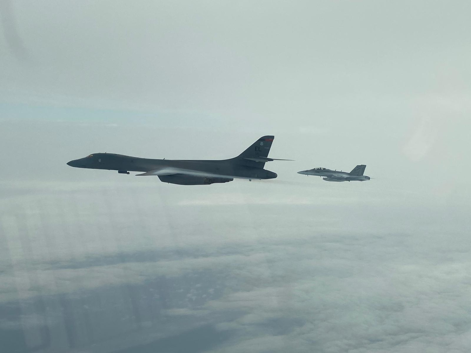 A B-1B Lancer from the 34th Expeditionary Bomb Squadron, Ellsworth Air Force Base, S.D., conducts integration training with a Koku-Jieitai, or Japanese Air Self-Defense Force (JASDF), F-15J in the Sea of Japan, Sept. 30, 2020. The B-1s integrated with Koku-Jietai to enhance bilateral interoperability and mutual readiness between the U.S. and Japan. (Courtesy photo)