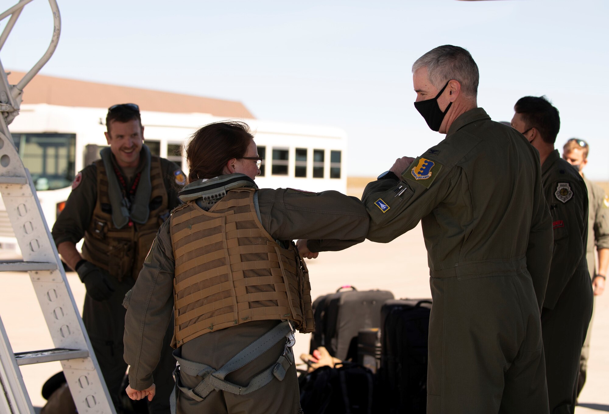 Airmen from the 34th Expeditionary Bomb Squadron, Ellsworth Air Force Base, S.D., greet each other after completing a Bomber Task Force deployment, Oct. 1, 2020. The deployment brought 34th EBS Airmen to Andersen AFB, Guam, to conduct training missions in support of a free and open Indo-Pacific. (U.S. Air Force photo by Airman 1st Class Christina Bennett)