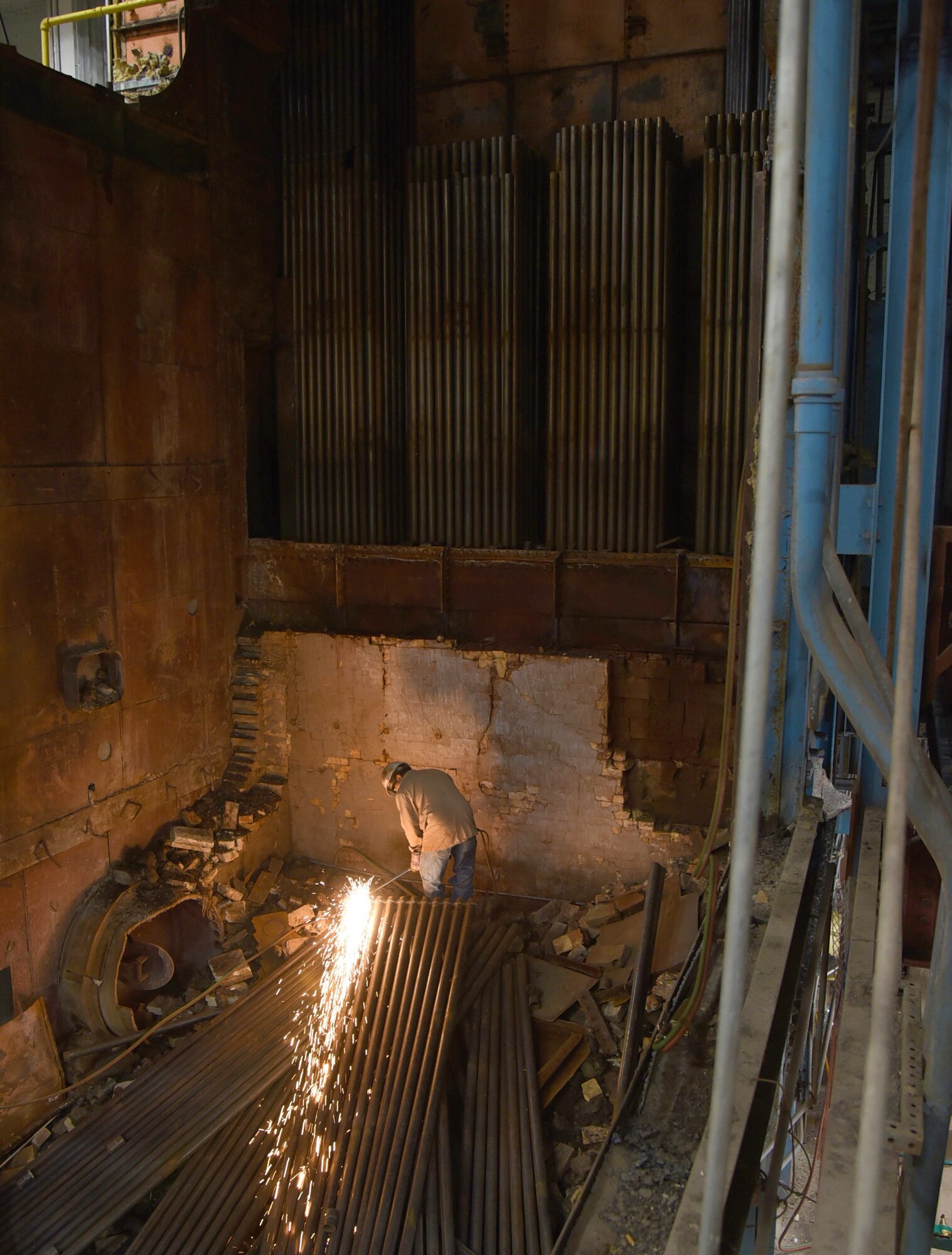 A construction worker works in the demolition site of Boiler #1 in Bldg. 3001 on Tinker Air Force Base, Oklahoma.