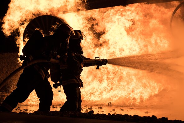Airmen extinguish live fire during exercise
