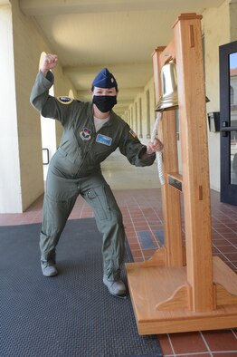 Lt. Col. Annie Driscoll, AFRS Det. 1 commander, rings the ceremonial bell in honor of AFRS making recruiting goal for fiscal 2020.