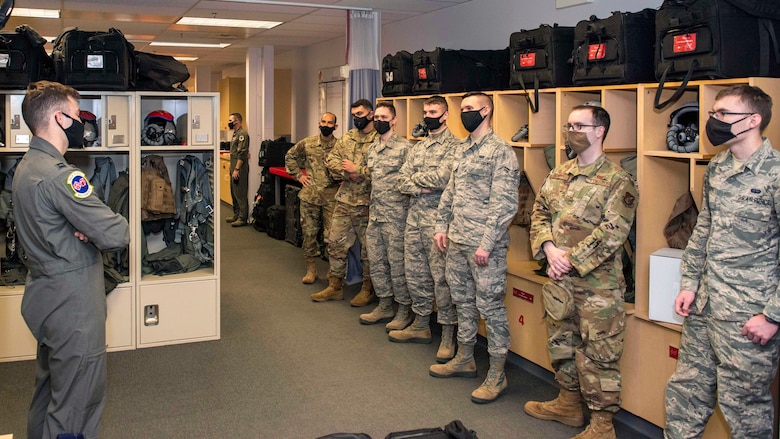 U.S. Airmen with the 673d Communications Squadron attend a 90th Fighter Squadron immersion at Joint Base Elmendorf-Richardson, Alaska, Sept. 29, 2020. The tour provided the Airmen with a behind-the-scenes experience of the operations in the 90th FS and showcased the 90th FS’s mission that JBER’s Airmen support. Leadership of the 90th FS hopes to expand the program in the future.