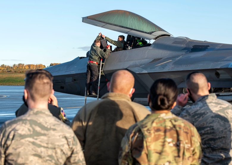 U.S. Airmen with the 673d Communications Squadron attend a 90th Fighter Squadron immersion at Joint Base Elmendorf-Richardson, Alaska, Sept. 29, 2020. The tour provided the Airmen with a behind-the-scenes experience of the operations in the 90th FS and showcased the 90th FS’s mission that JBER’s Airmen support. Leadership of the 90th FS hopes to expand the program in the future.