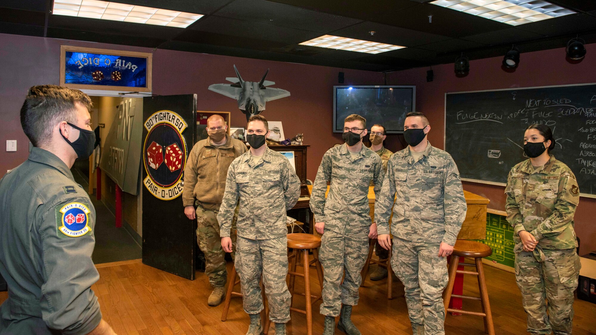U.S. Airmen with the 673d Communications Squadron attend a 90th Fighter Squadron immersion at Joint Base Elmendorf-Richardson, Alaska, Sept. 29, 2020. The tour provided the Airmen with a behind-the-scenes experience of the operations in the 90th FS and showcased the 90th FS’s mission that JBER’s Airmen support. Leadership of the 90th FS hopes to expand the program in the future.