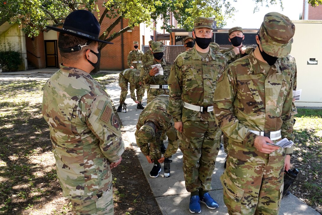 U.S. Air Force Tech. Sgt. Marcos Garcia, 37th Training Wing Detachment 5 military training instructor, confronts basic military training trainees outside Erwin Manor at Keesler Air Force Base, Mississippi, Oct. 1, 2020. Garcia showcases the need for diversity by encouraging those he supervises to embrace the cultures of others in the military to help make a stronger Air Force. (U.S. Air Force photo bus Airman 1st Class Seth Haddix)