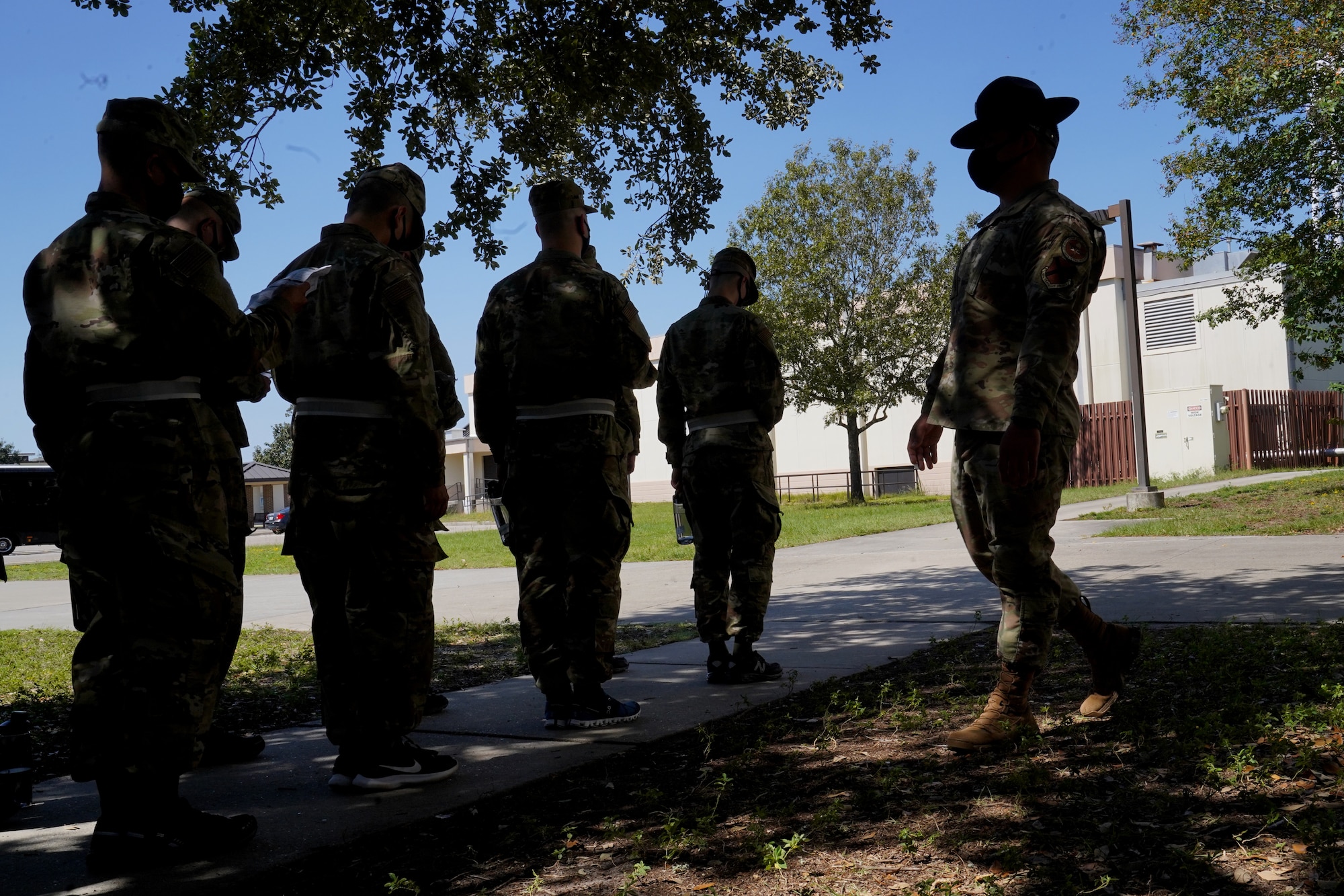U.S. Air Force Tech. Sgt. Marcos Garcia, 37th Training Wing Detachment 5 military training instructor, confronts basic military training trainees outside Erwin Manor at Keesler Air Force Base, Mississippi, Oct. 1, 2020. Garcia showcases the need for diversity by encouraging those he supervises to embrace the cultures of others in the military to help make a stronger Air Force. (U.S. Air Force photo bus Airman 1st Class Seth Haddix)