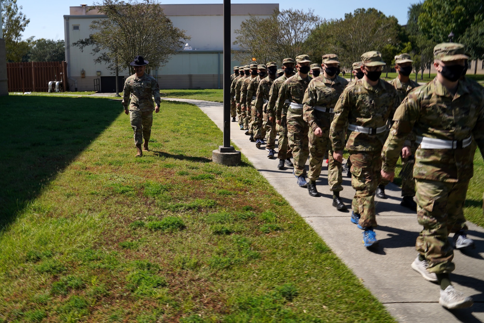 U.S. Air Force Tech. Sgt. Marcos Garcia, 37th Training Wing Detachment 5 military training instructor, marches basic military training trainees outside Erwin Manor at Keesler Air Force Base, Mississippi, Oct. 1, 2020. Garcia showcases the need for diversity by encouraging those he supervises to embrace the cultures of others in the military to help make a stronger Air Force. (U.S. Air Force photo bus Airman 1st Class Seth Haddix)