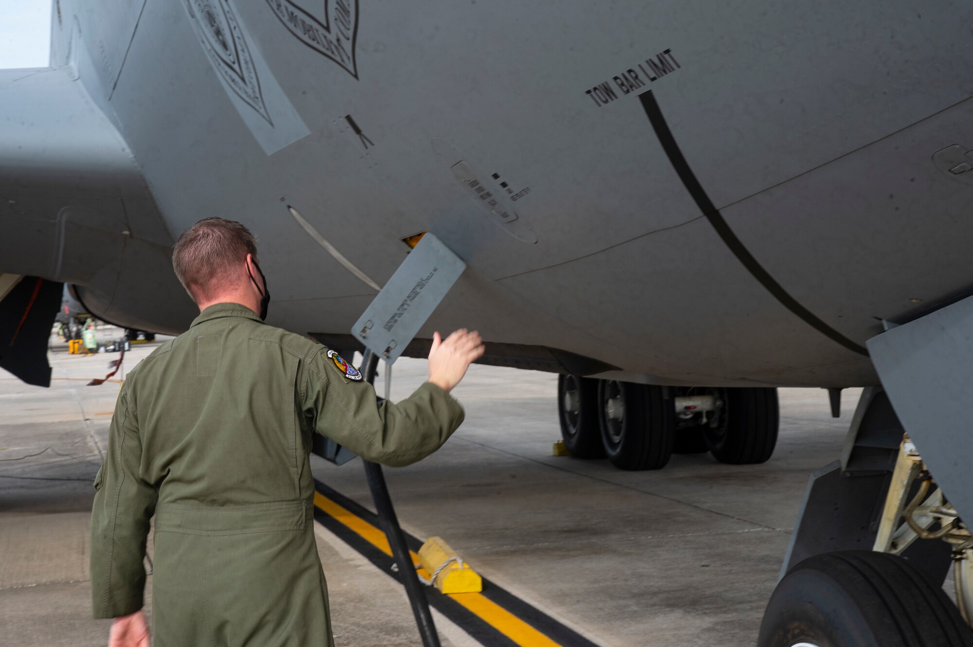 U.S. Air Force Maj. Doug Karl, a pilot assigned to the 91st Air Refueling Squadron, conducts a pre-flight walk-around inspection on a KC-135 Stratotanker aircraft, at MacDill Air Force Base, Fla., Sept. 30, 2020.