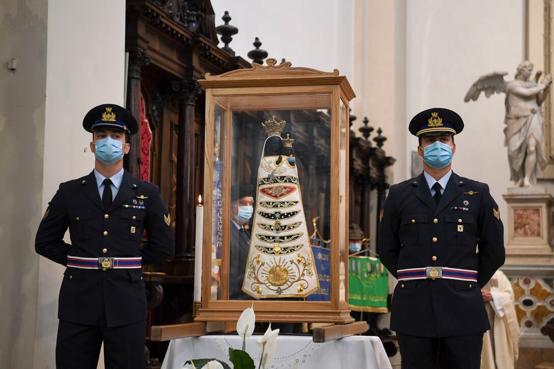 Two Italian air force members stand guard by a Madonna Di Loreto statue in Pordenone, Italy, Sept. 29, 2020. The Madonna Di Loreto is the Patroness of Aeronauts, as declared by Pope Benedict XV. (U.S. Air Force photo by Staff Sgt. Savannah L. Waters)