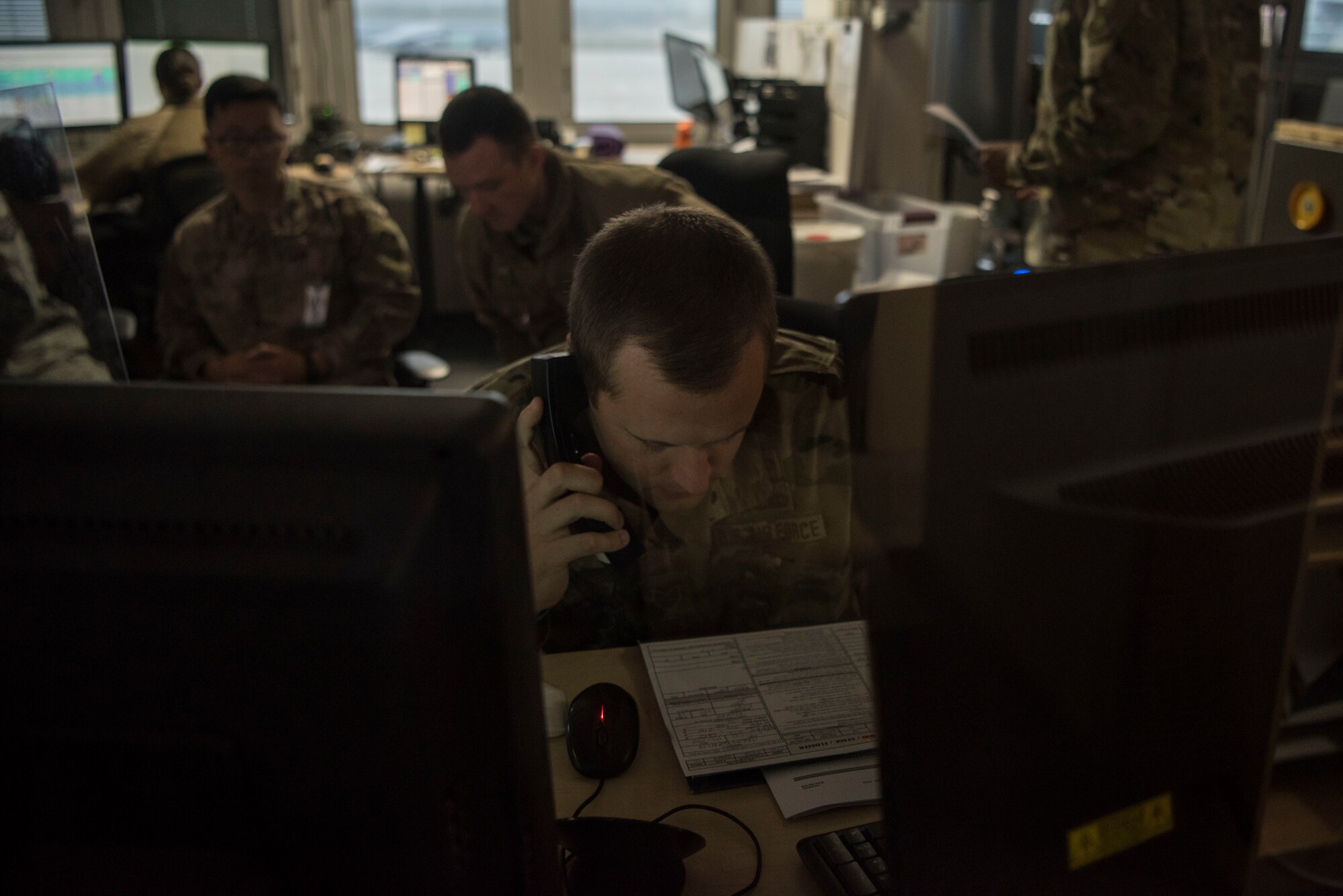U.S. Air Force Tech. Sgt. Richard Ton, 721st Aircraft Maintenance Squadron crew chief, communicates with aircrew during a multi-capable Airmen lift-and-shift training exercise.