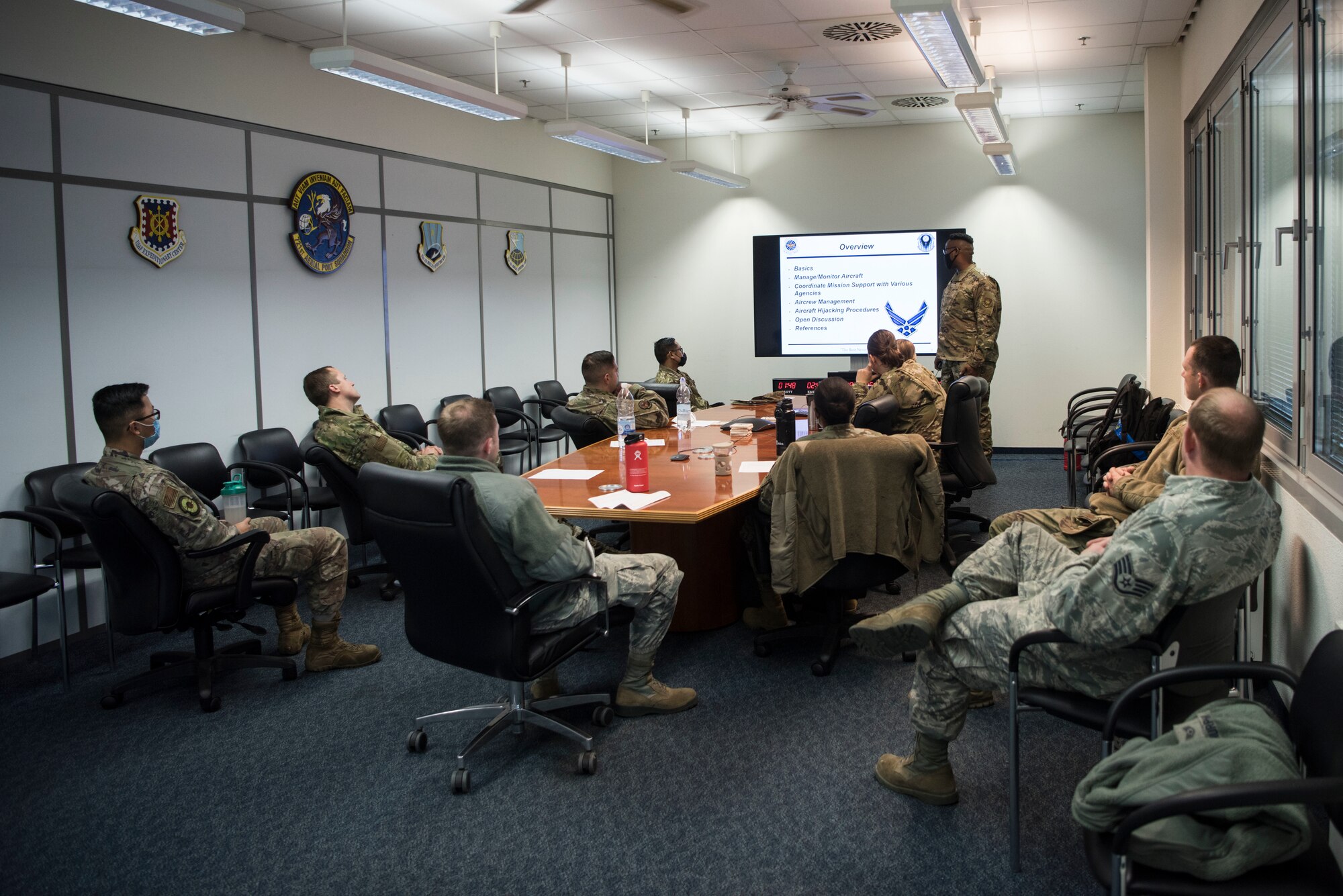 U.S. Air Force Tech. Sgt. Zachary Martin, 721st Mobility Support Squadron command and control noncommissioned officer in charge, gives a briefing to Airmen assigned to the 721st Air Mobility Operations Group during a multi-capable Airmen lift-and-shift training exercise