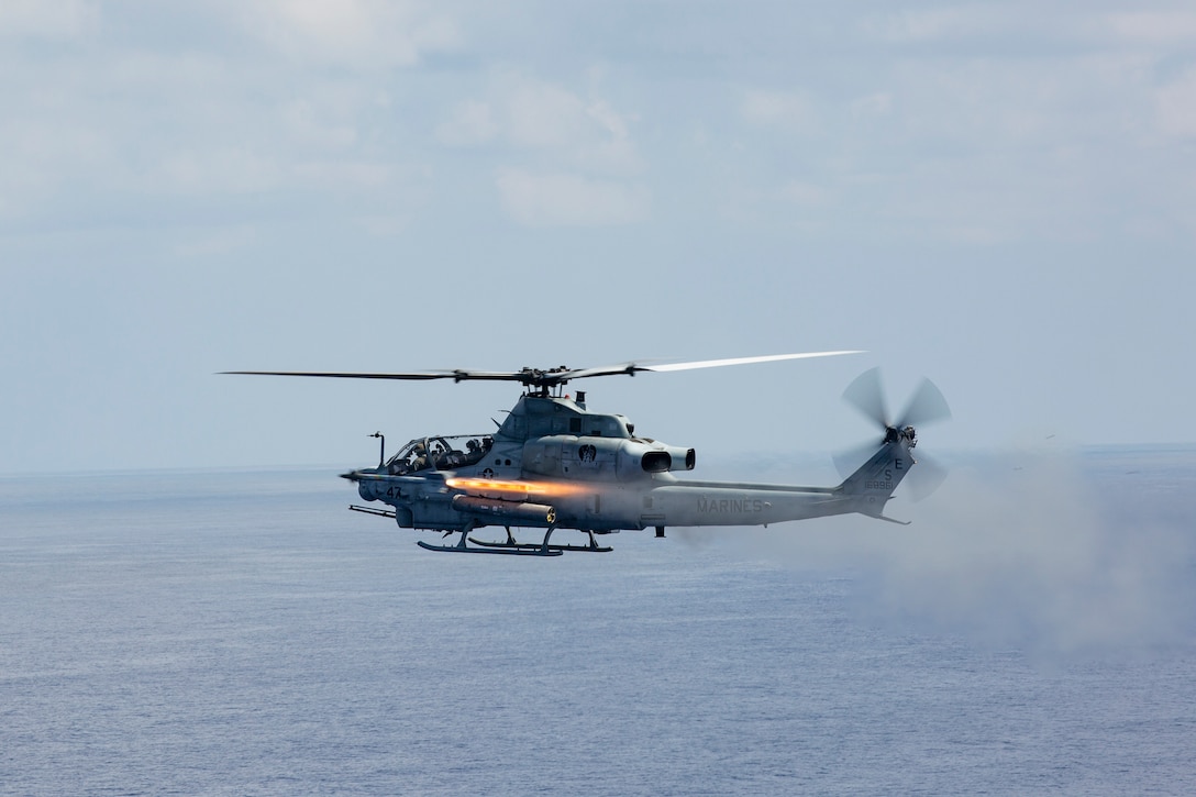 A U.S. Marine Corps AH-1Z Viper helicopter with Marine Light Attack Helicopter Squadron (HMLA) 469 fires an Air Intercept Missile (AIM-9), or Sidewinder missile, during a live-fire training event near Okinawa.
