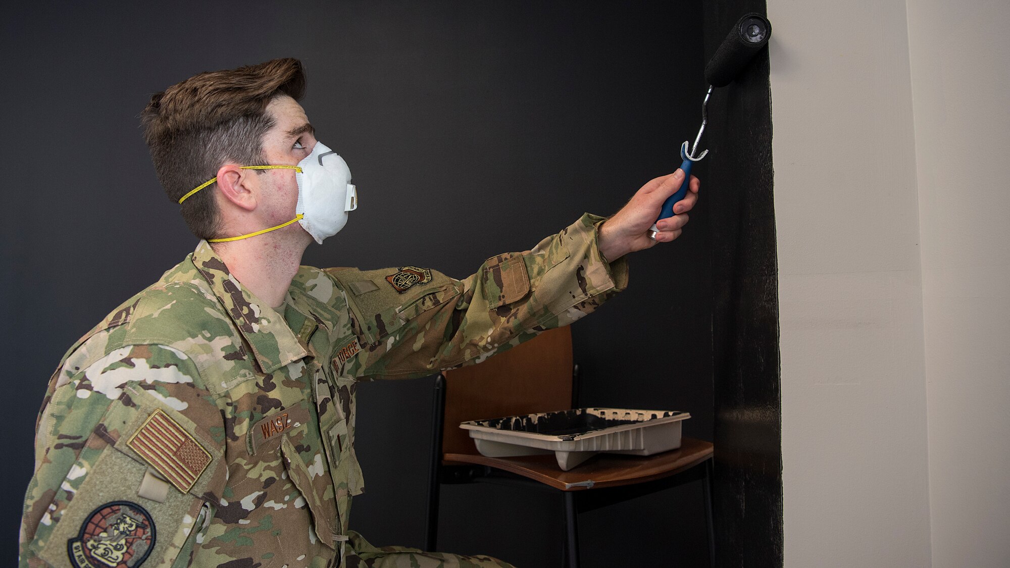 U.S. Air Force 2nd Lt. Charles Wasz, a 91st Air Refueling Squadron casual status pilot awaiting training, paints a wall in the 91st ARS heritage room at MacDill Air Force Base, Sept. 29, 2020.