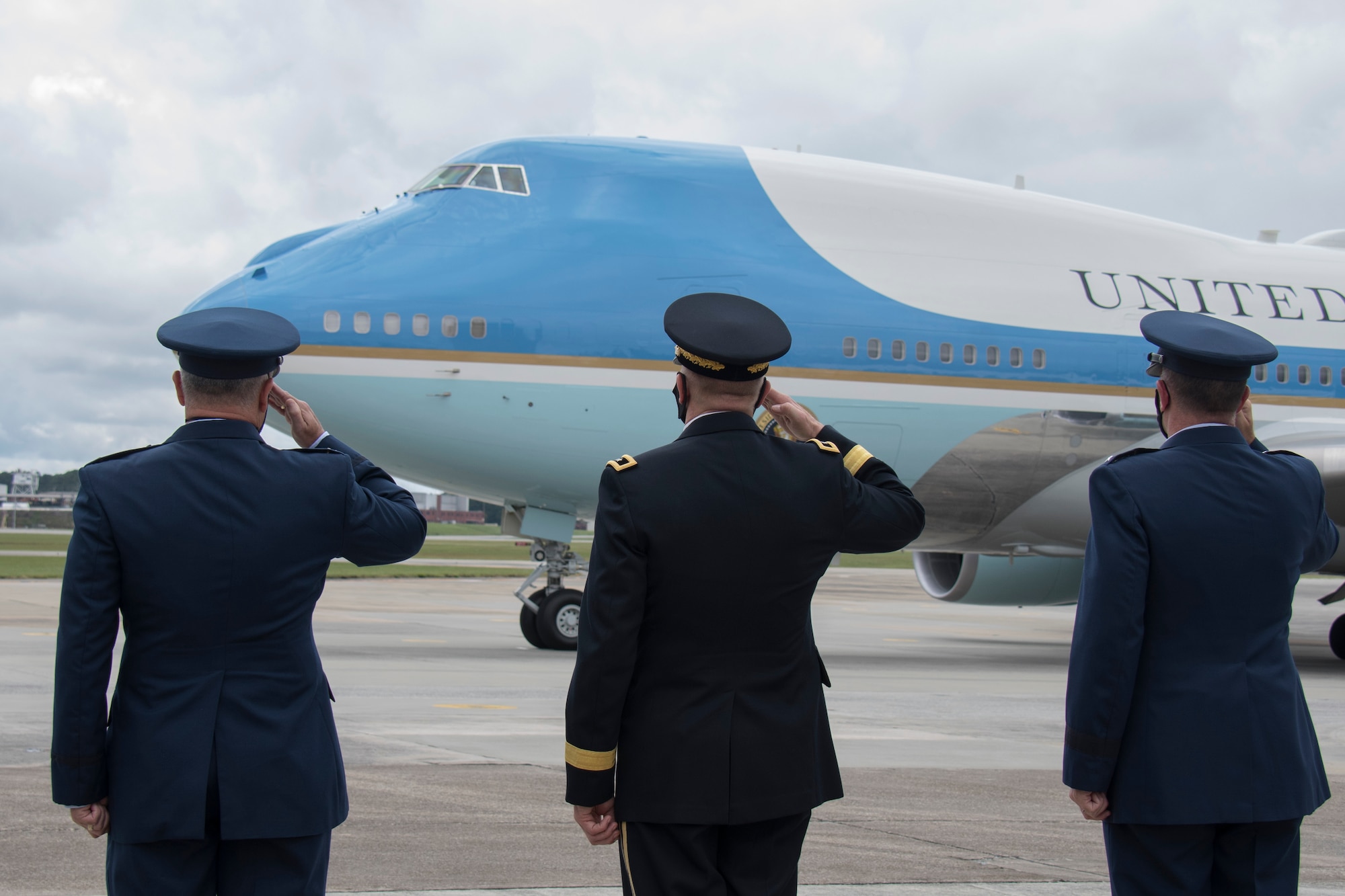 Col. Craig McPike, 94th Airlift Wing commander; Maj. Gen. Tom Carden, The Adjutant General of Georgia; and Maj. Gen. John Healy, 22nd Air Force commander, salute as Air Force One taxis at Dobbins Air Reserve Base, Ga., Sept. 25, 2020. The president arrived at Dobbins to attend a meeting at the Cobb Galleria. (U.S. Air Force photo/Andrew Park)
