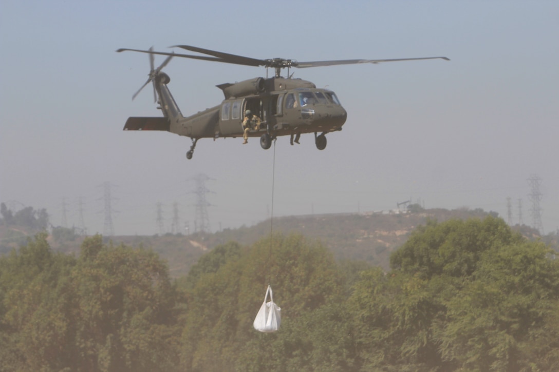 A U.S. Army UH-60M Black Hawk helicopter flown by a crew from the California National Guard's Army Aviation Support Facility #1 at Joint Forces Training Base, Los Alamitos
