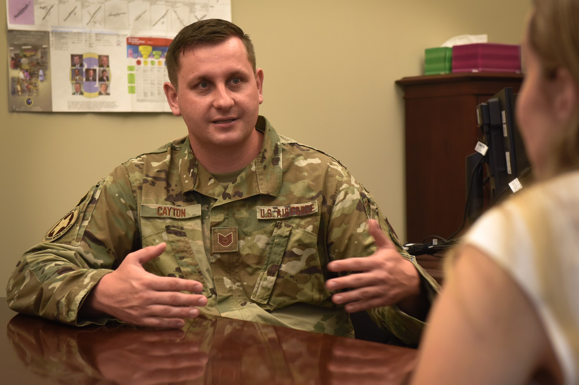 U.S. Air Force Tech. Sgt. Justin Cayton, a production recruiter for the 169th Fighter Wing, speaks to and provides a tour of the South Carolina Air National Guard to Ashley Spivey, a potential recruit, at McEntire Joint National Guard Base on August 17, 2020. Tour bases are necessary in order to expose applicants to the wing and potential jobs.  (U.S. Air National Guard photo by Senior Airman Mackenzie Bacalzo, 169th Fighter Wing Public Affairs)
