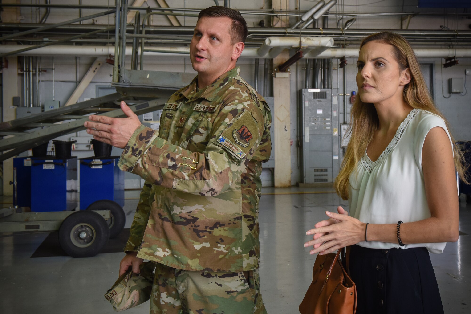 U.S. Air Force Tech. Sgt. Justin Cayton, a production recruiter for the 169th Fighter Wing, speaks to Ashley Spivey, a potential recruit, and provides a tour of the South Carolina Air National Guard at McEntire Joint National Guard Base on August 17, 2020. Cayton utilizes base tours in order to educate potential applicants on opportunities within the South Carolina Air National Guard.  (U.S. Air National Guard photo by Senior Airman Mackenzie Bacalzo, 169th Fighter Wing Public Affairs)